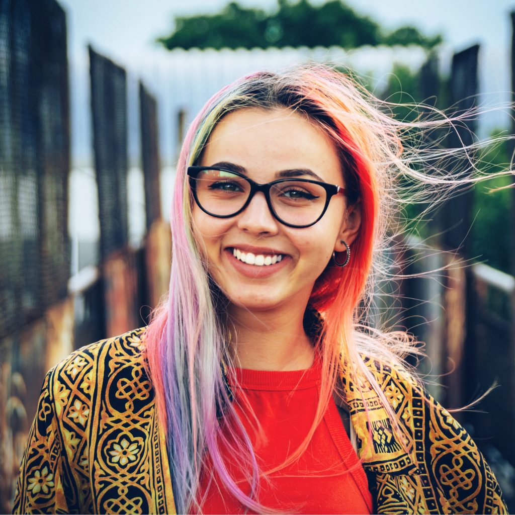 Young girl with colorful hair taking a selfie