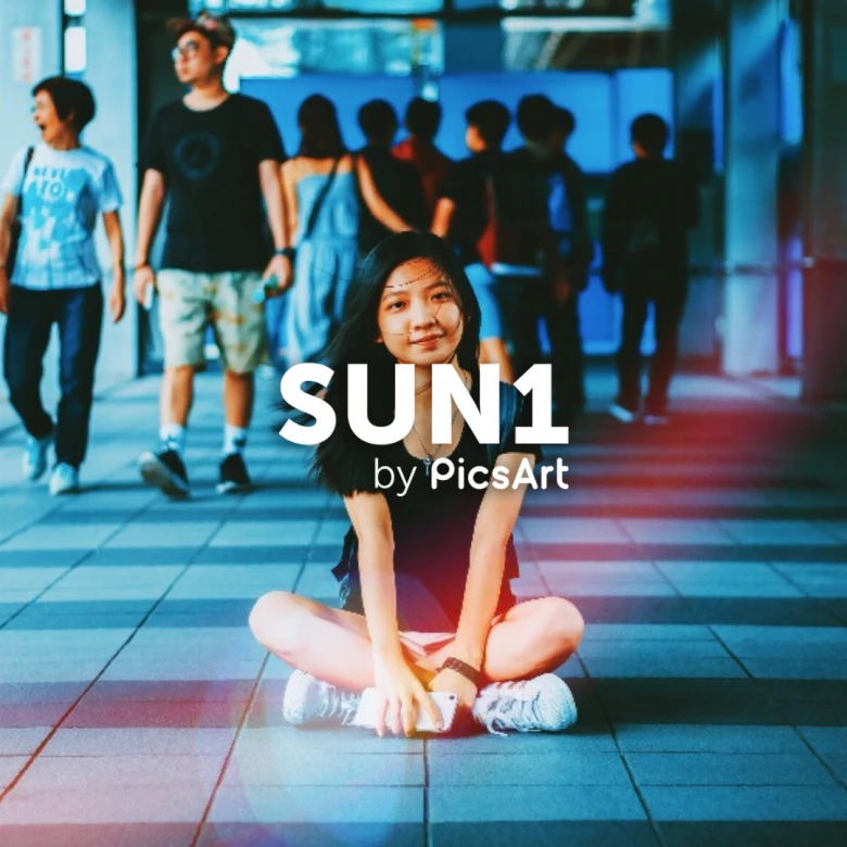 Girl sitting in an urban area with PicsArt SUN1 filter and Light Mask