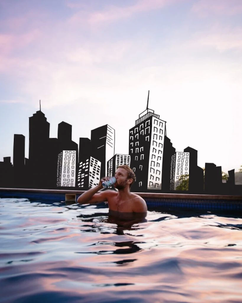 Cityscape edit of man drinking