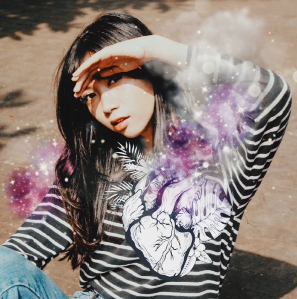 asian girl with beating heart sticker