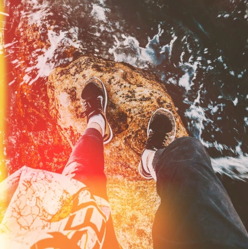 standing on top of the rock with sun series filter