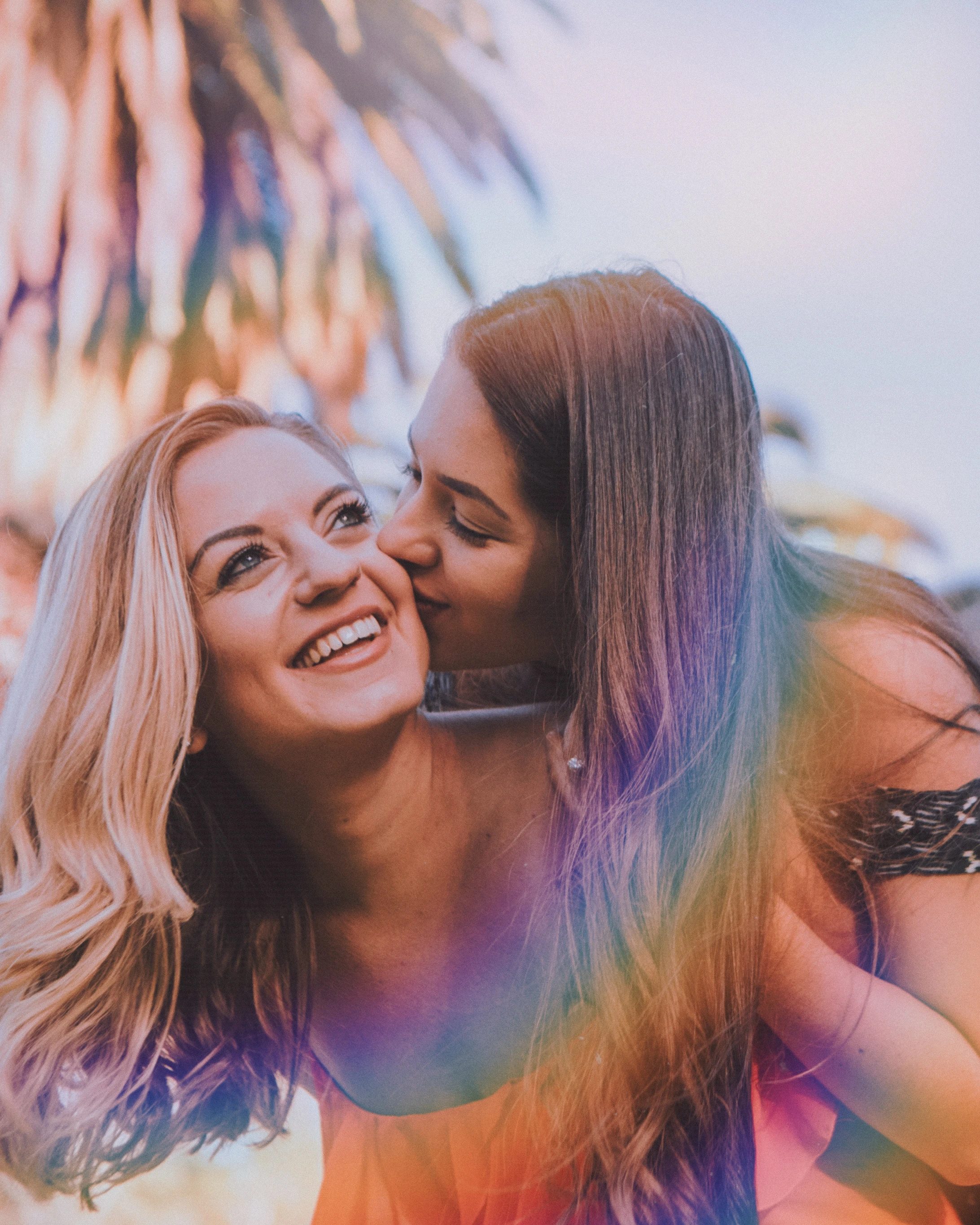 back view of a female couple with rainbow color effect