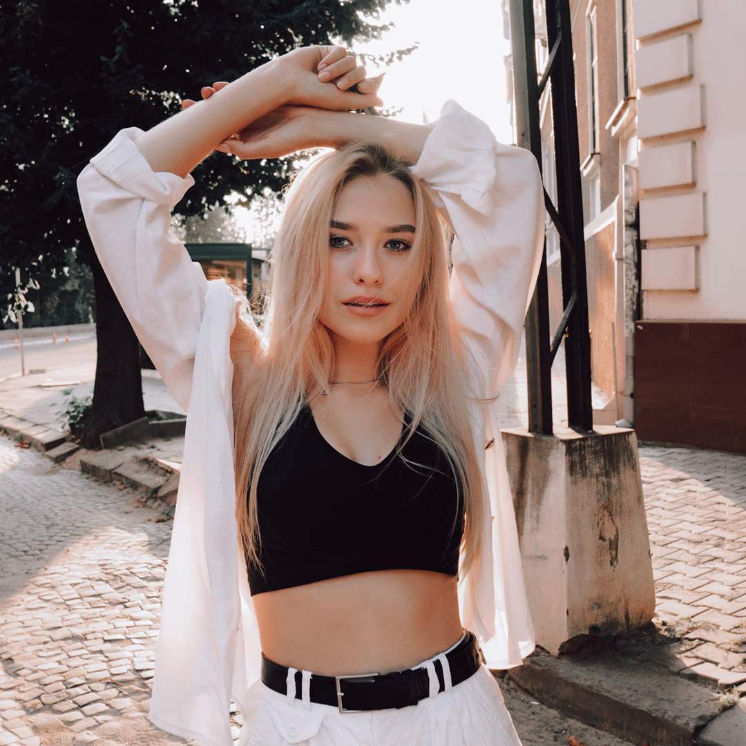 Instagram filter on a blonde girl wearing a crop top