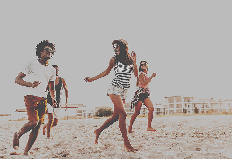 Film grain effect on a group of young people at the beach