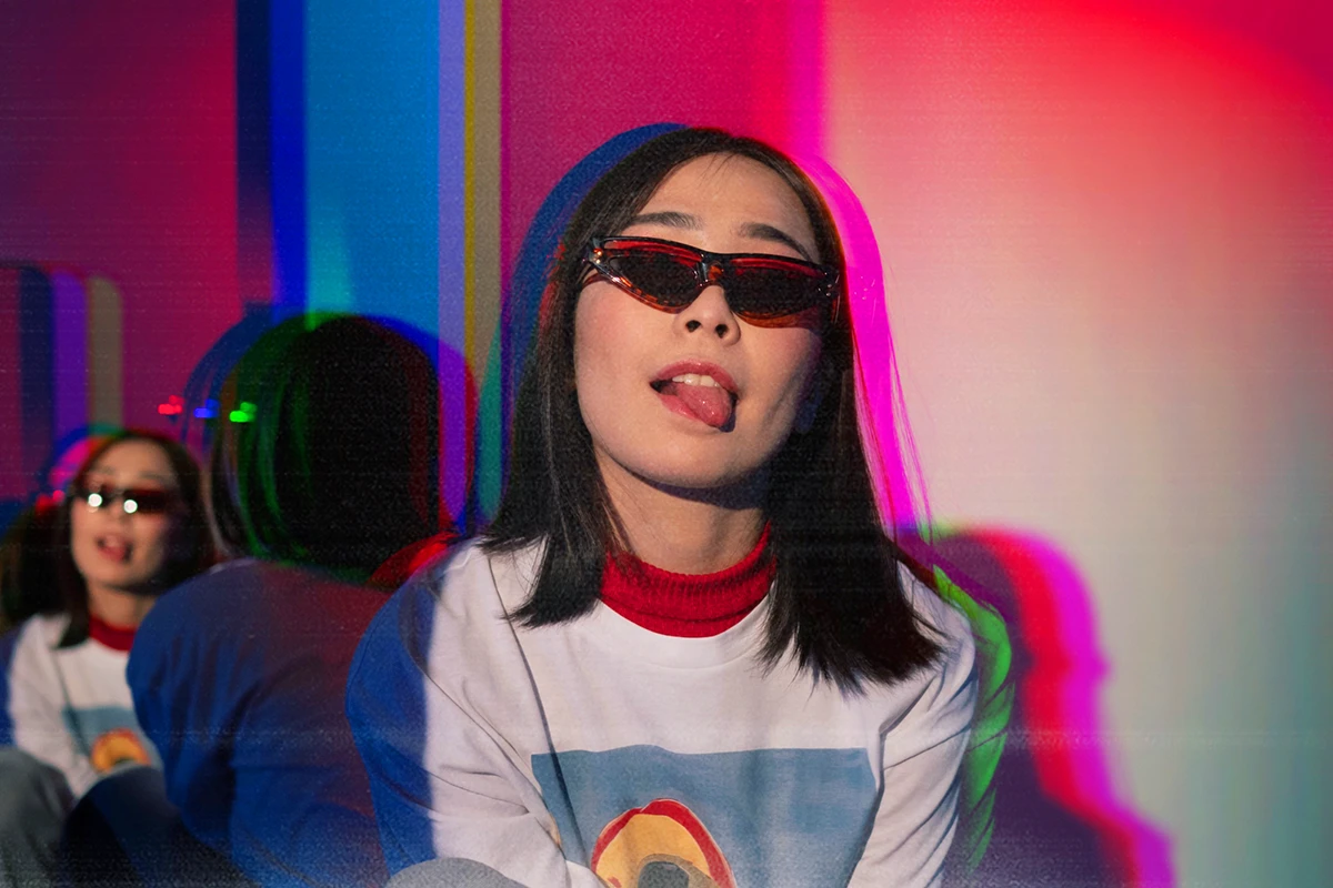 woman sticking her tongue out with a glitch effect on the photo 