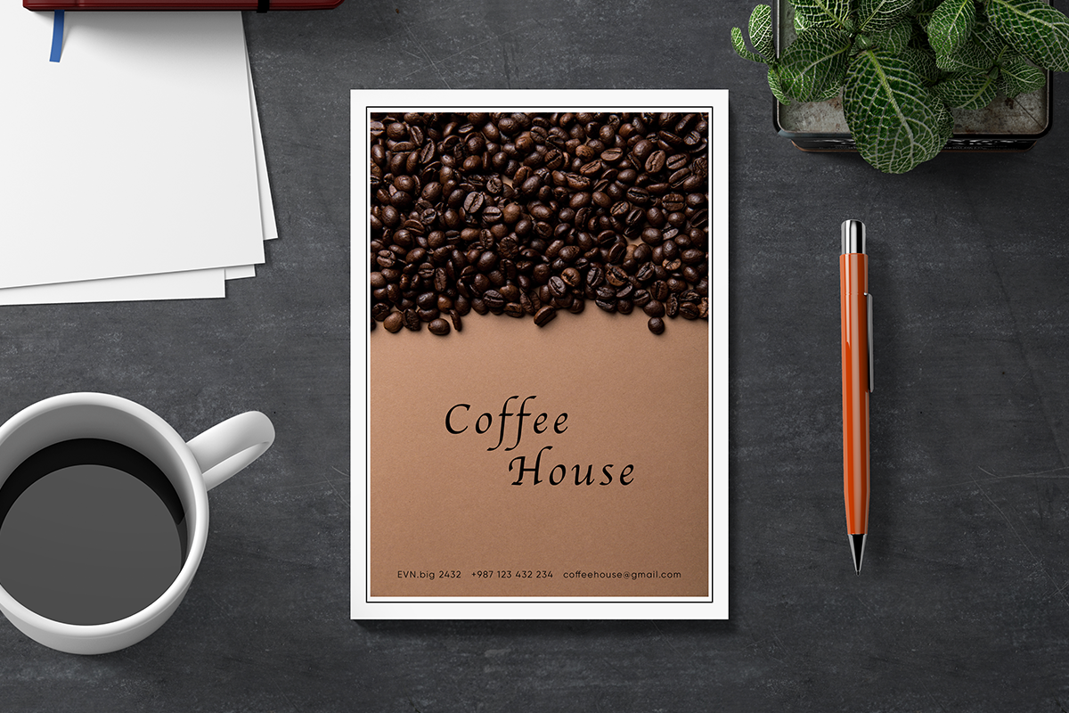 coffee house flyer with a coffee cup and pencil on a dark desk