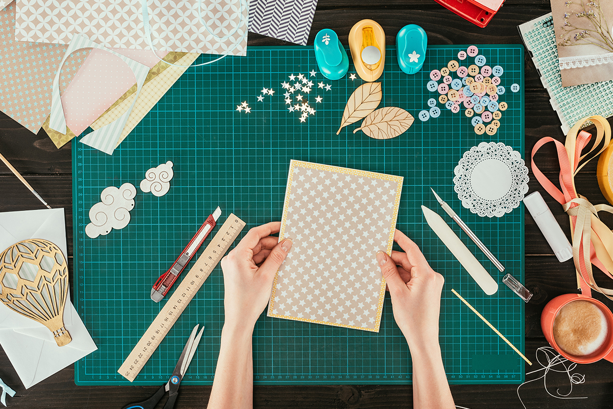 overhead shot of someone scrapbooking