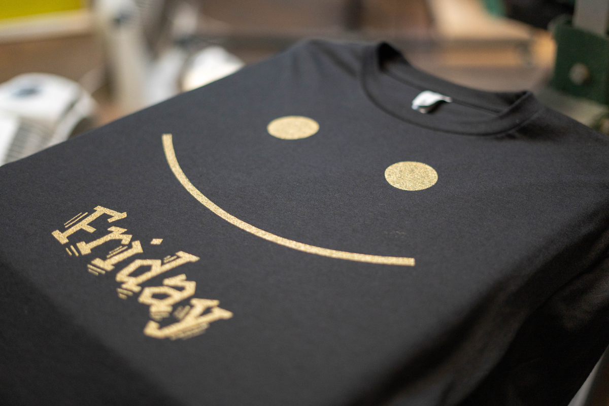 yellow smiley face Friday design printed on a t-shirt