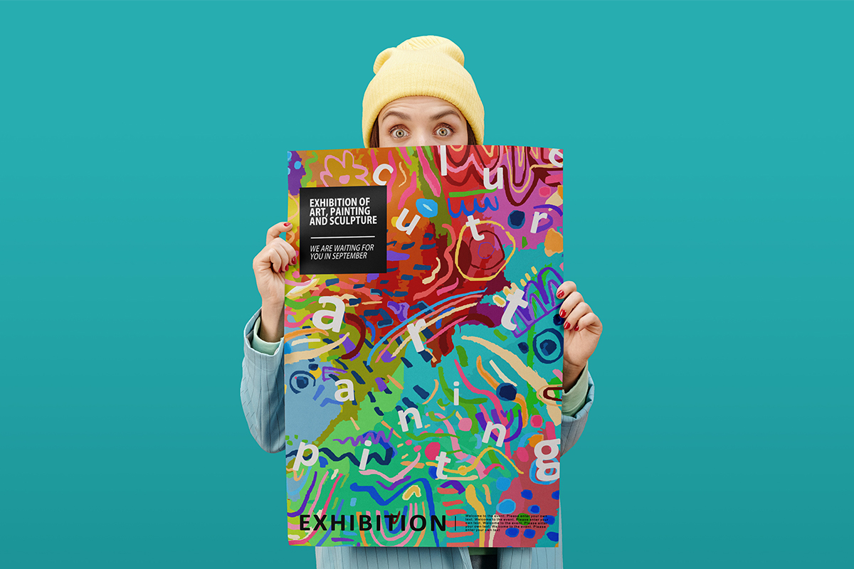 woman holding a colorful poster