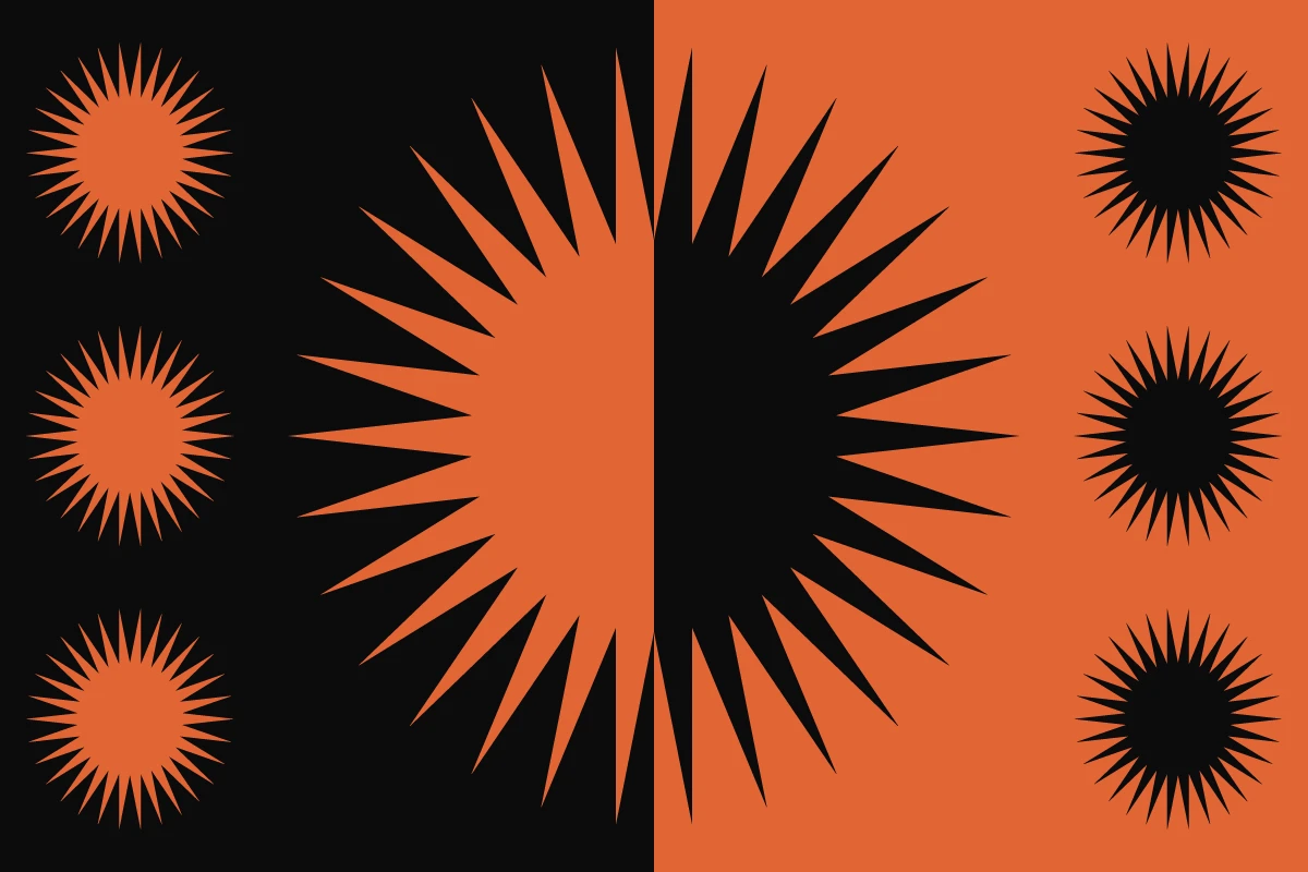 orange and black sun created with negative space