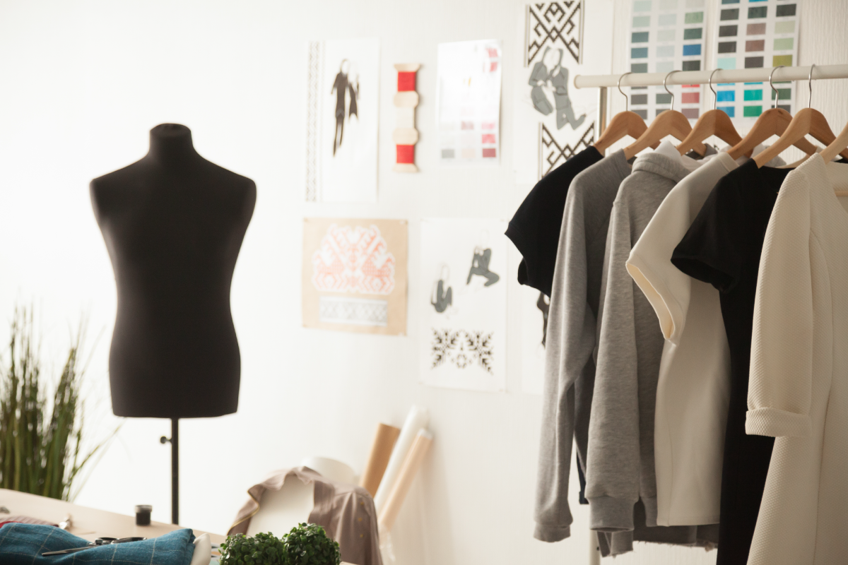 picture of clothes on a rack and a mannequin 