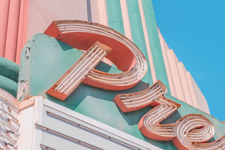 close up shot of pastel colors on an art deco building and sign