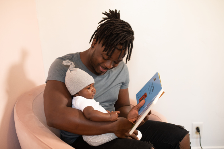 dad reading to baby