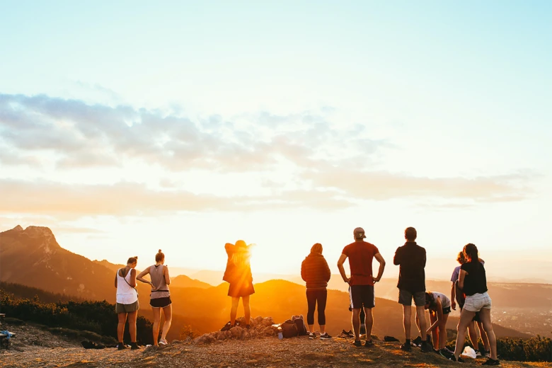 golden hour photo of friends on a hike