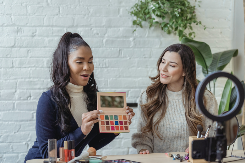 influencers doing a demonstration of a beauty product