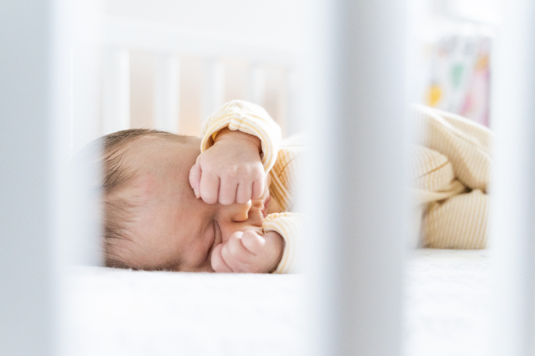 newborn baby at home photo idea of child sleeping in crib