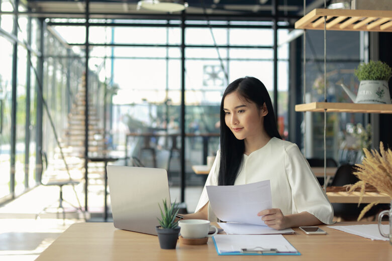 woman sitting at laptop trying to convert pdf to word